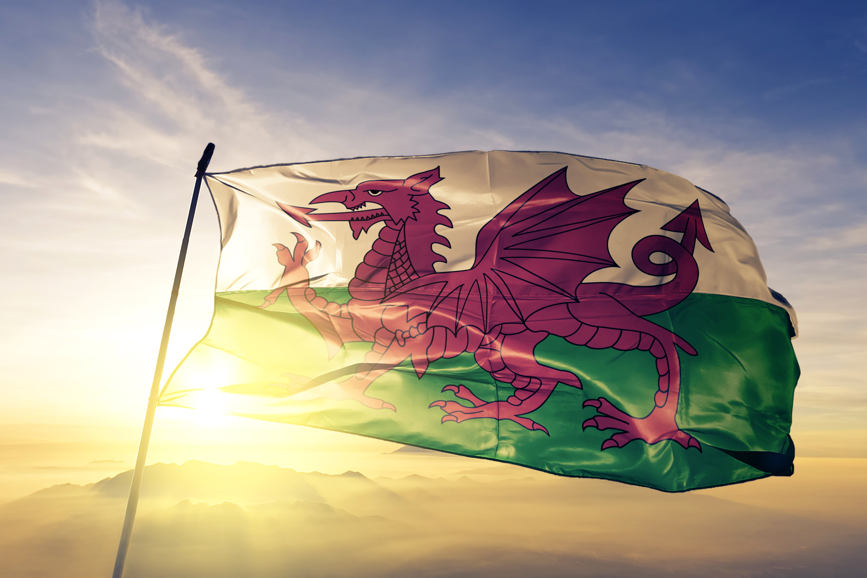 Wales flag billowing in sunlight