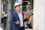 Man in hard hat with glasses inspecting shipment